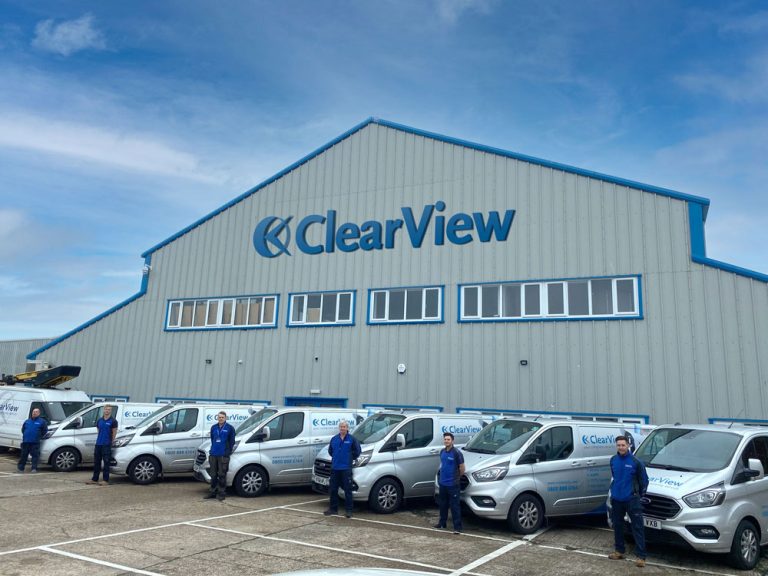 ClearView Security Team standing outside their fleet of vehicles