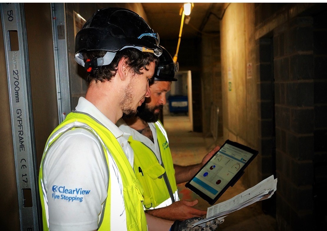 Two Clearview team members conducting a fire stopping survey